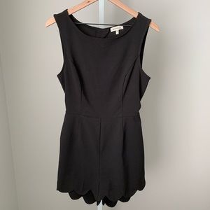 Scalloped black romper with open back